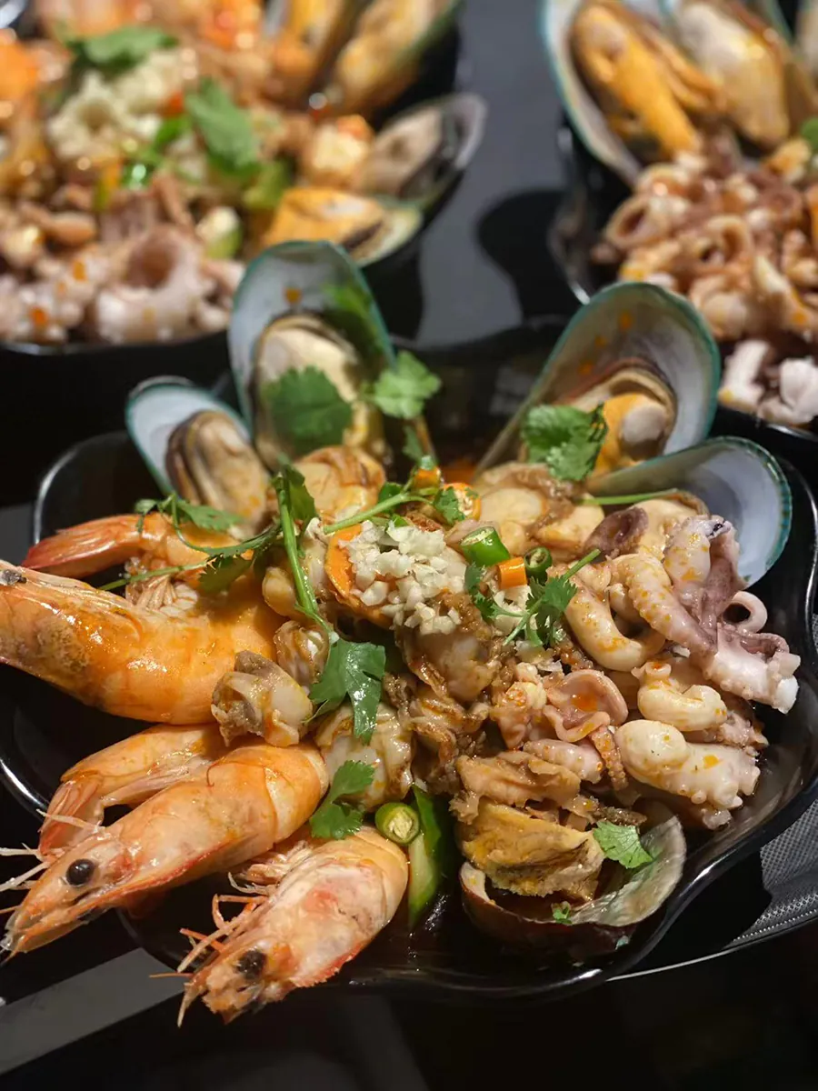 shrimp, clam, scallop, squid in spicy sauce at Gourd Bro BBQ，a Barbecue Restaurant in City of Industry